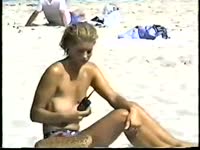 Voyeur with an appetite for an exposed teenager finds this naked whore on the public beach